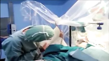 Musician plays Saxophone while surgeons carry out brain op