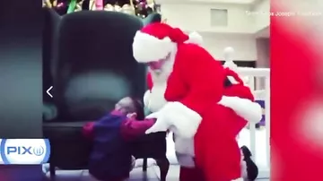 Moment little boy asks Santa to pray for baby he's never met