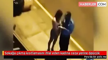 Karantini pozan qız cərimə yazılmasın deyə polisi öpdü, kameraya düşdü