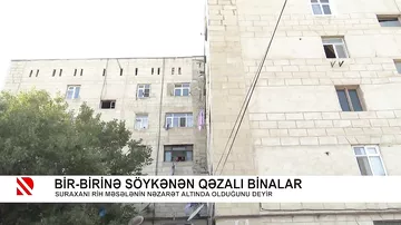 Bir-birinə söykənən qəzalı binalar