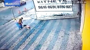 Horrifying moment a toddler falls from a second-floor window