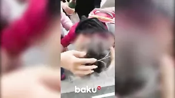 İranda əxlaq polisi etiraz edən qadının başını yardı