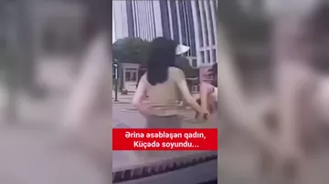 Ərinə əsəbiləşən qadın küçənin ortasında SOYUNDU