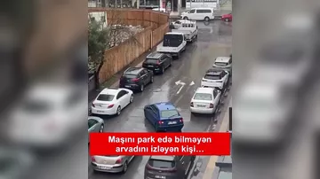 Evlərinin qarşısında avtomobili park edə bilməyən həyat yoldaşını balkondan lentə alan ər üsyan etdi
