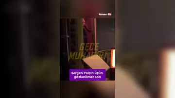 Baş məşqçi gecə gəzintisində iki qızla görüntüləndi