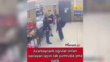 Azərbaycanlı oğrular market işçisini tək yumruqla yerə sərdi