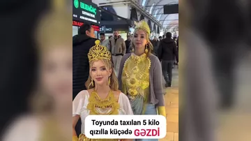 Toyunda ona verilən 5 kilo qızılla küçədə GƏZDİ