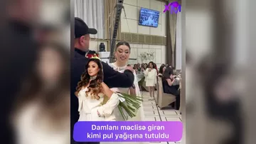 Damlanı məclisə girən kimi pul yağışına tutdular