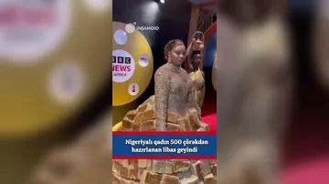 500 çörəkdən hazırlanan libas birmənalı qarşılanmayıb..