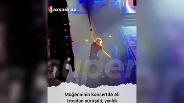 Müğənni Dmitri Bikbayevin konsertdə əli trosdan sürüşdü, yıxıldı
