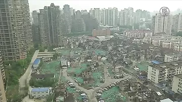 Шанхай: «упрямые» владельцы отказываются покидать дома