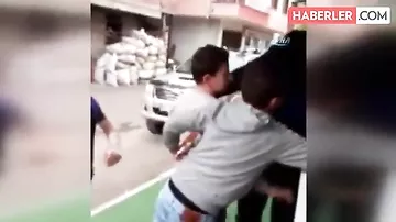 Uşaqlara sillə vurmaq qarşılığında dondurma verən market sahibinin VİDEOsu yayıldı